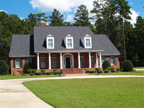 black metal roof on red brick house|red brick house roof colours.